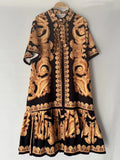 2026 Summer Women's New Fashion Geometric Print Lapel Short Sleeve Loose Dress Stitching Pleated Hem Temperament Straight Skirt.